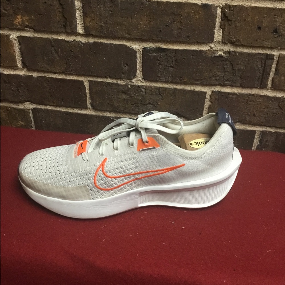 Nike Light Gray Running Shoe with Orange Swoosh